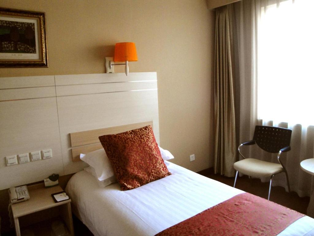 Overseas Chinese International Hotel 青島市 部屋 写真